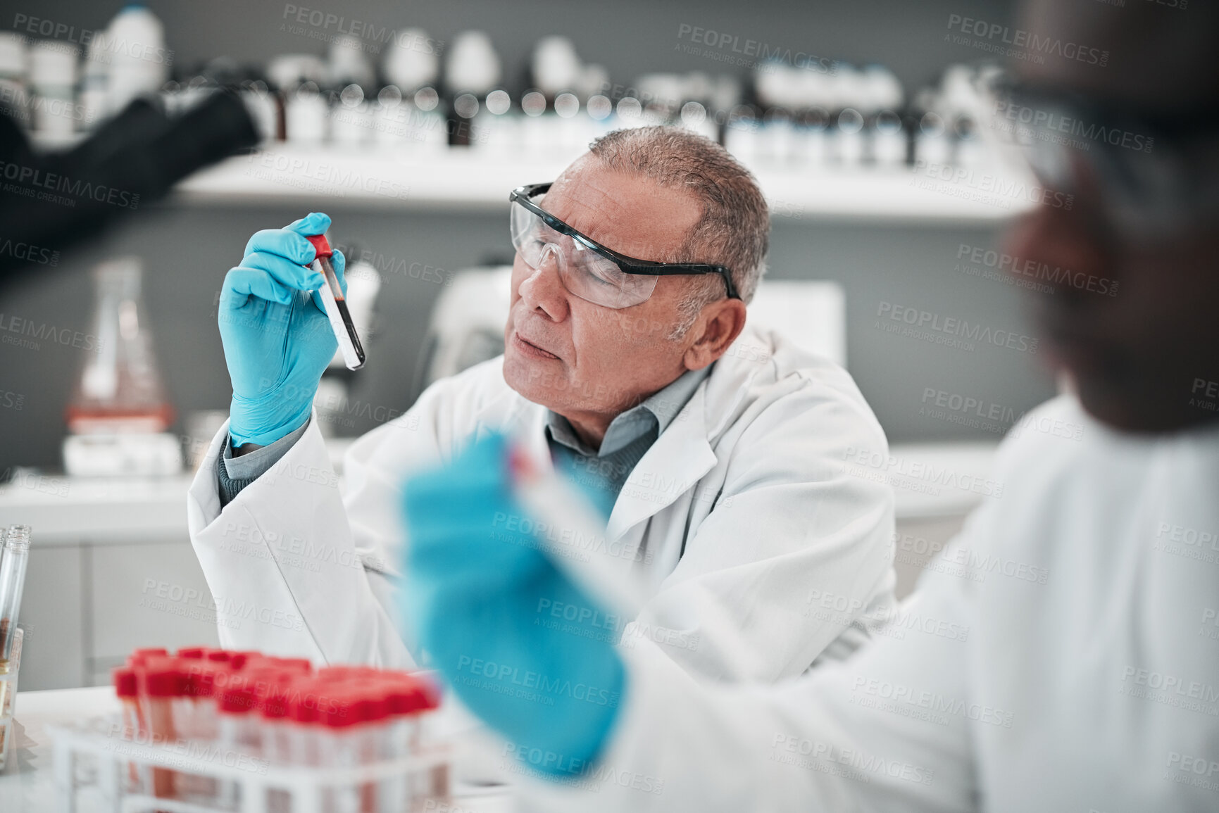 Buy stock photo Men, scientist and blood sample in lab, thinking and analysis with ppe glasses, safety and test. Science, pathology and expert with teamwork, inspection or check for medical research in laboratory