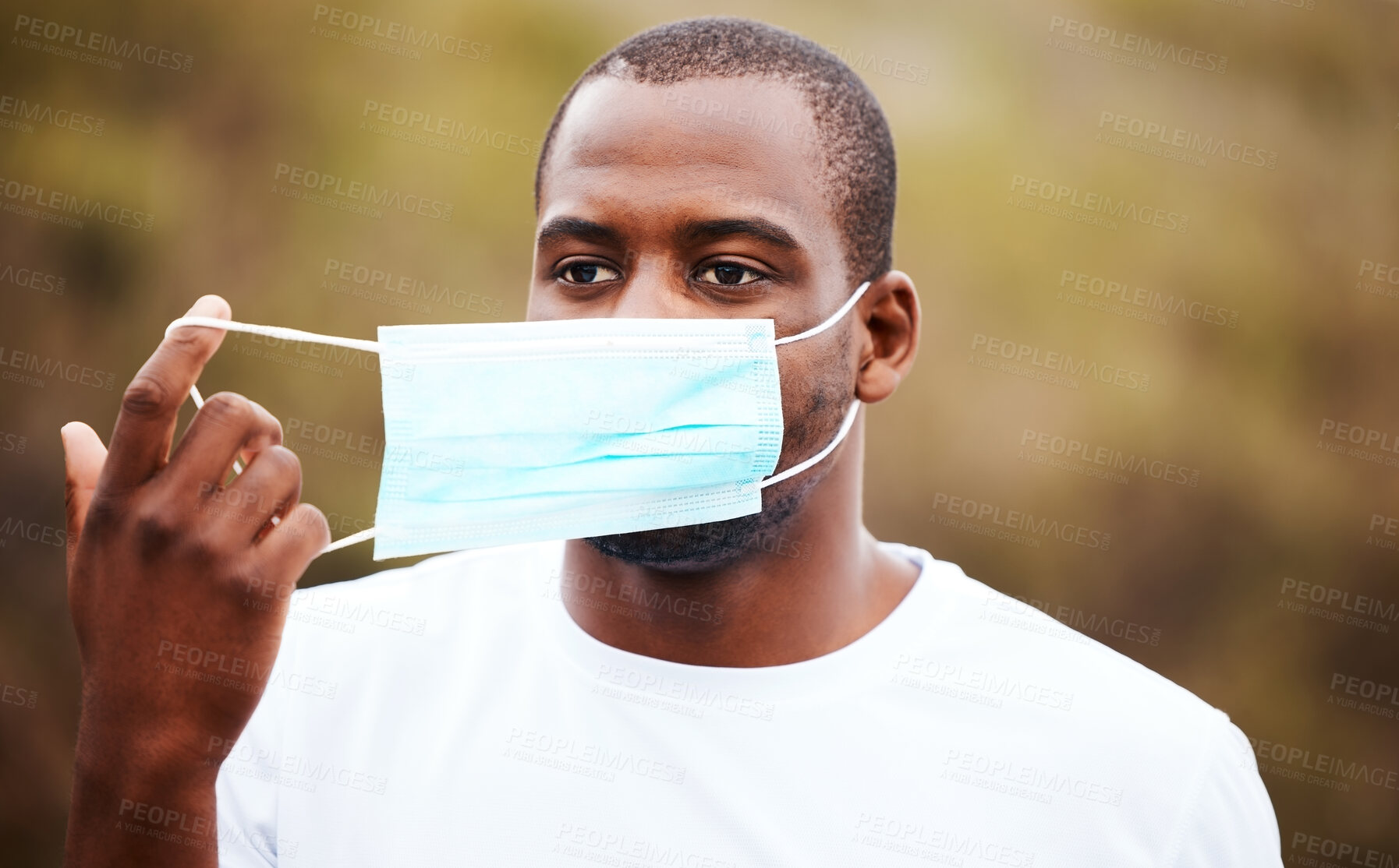 Buy stock photo Corona, outdoor and black man remove mask, regulations and pandemic policy with breathing, health and decrease infection rates. African person, nature and guy take off face cover, safety and freedom