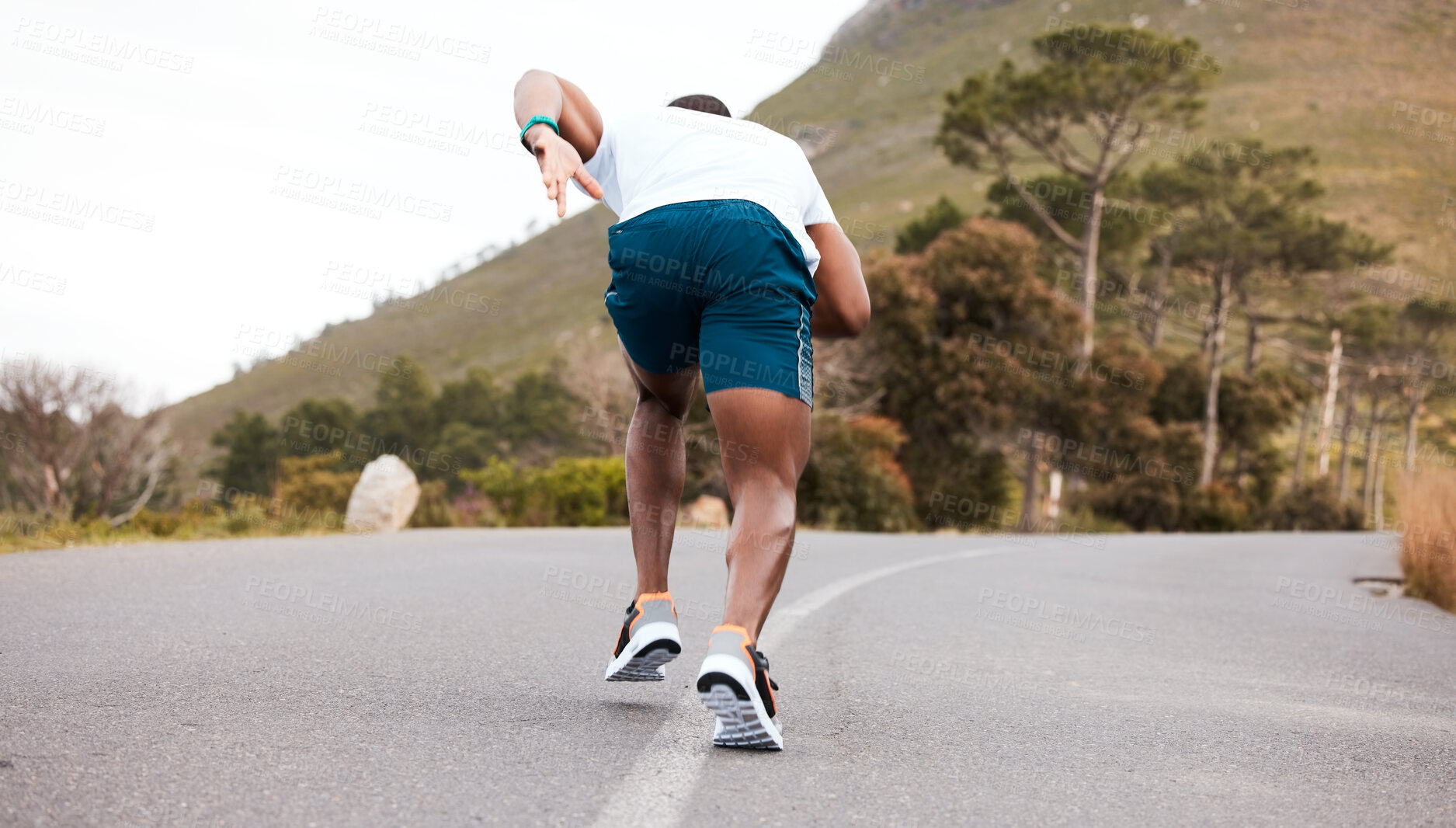 Buy stock photo Fitness, race or runner running on road by nature for exercise, training or outdoor workout. Back view, fast black man or active athlete on street with endurance, freedom or sports challenge on hill