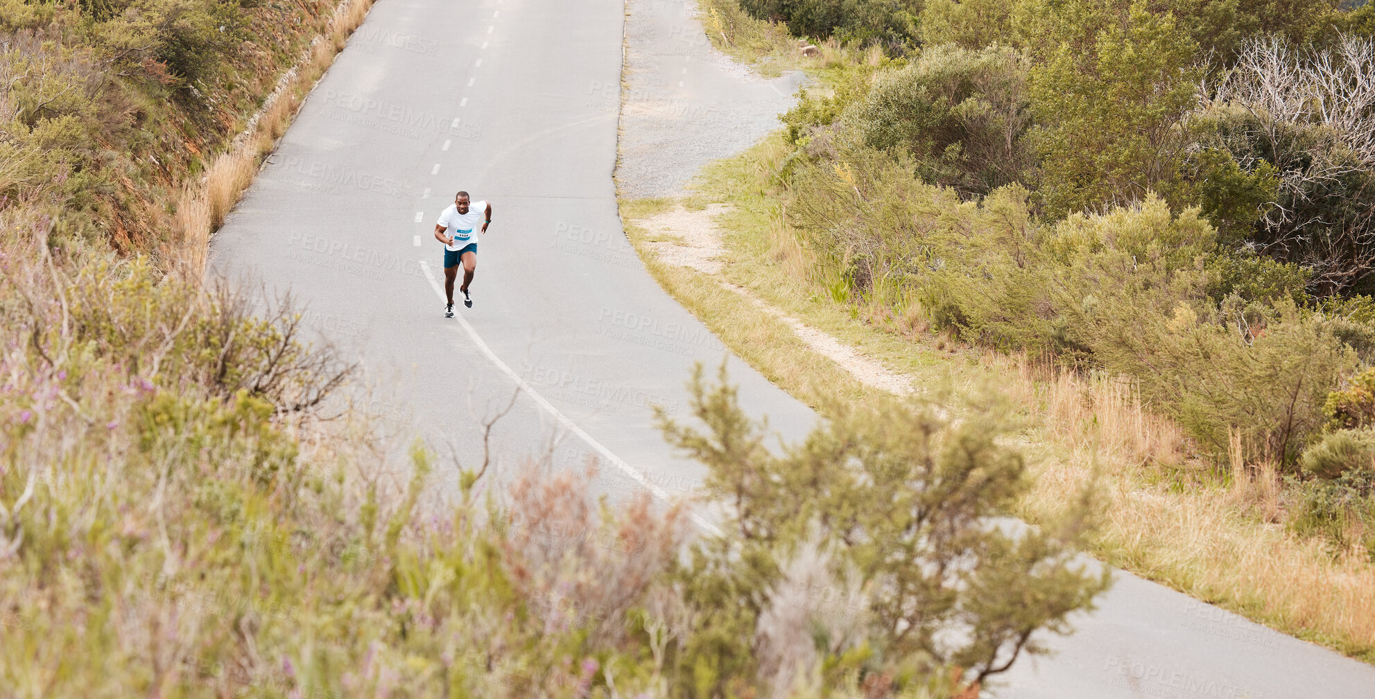 Buy stock photo Fitness, hill or runner running on a road by nature for exercise, training or outdoor workout. Sports race, fast black man or healthy active athlete on street with endurance, freedom or challenge