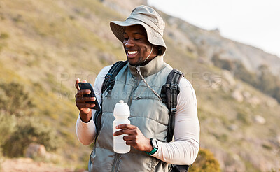 Buy stock photo Hiking, water bottle and black man with a cellphone, smile or hydration with fitness, travel or health. African person, guy or hiker with a smartphone, mountain or thirsty with exercise or connection