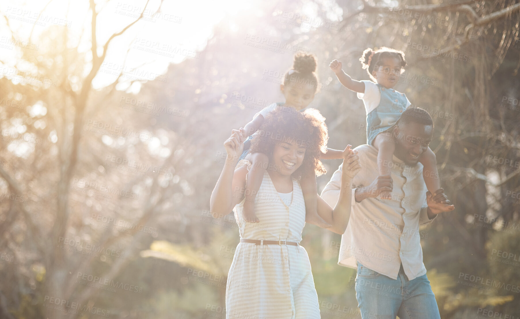 Buy stock photo Parents with kids in park, piggy back and walking for love, bonding or peace in nature together. Mother, father and children on shoulders in garden, black family on summer weekend in woods or forrest