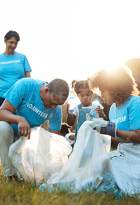 Buy stock photo Nature activist, volunteering and family cleaning garbage pollution, trash litter or throw plastic bottle in recycle bag. Eco collaboration, waste management and community group help with planet care