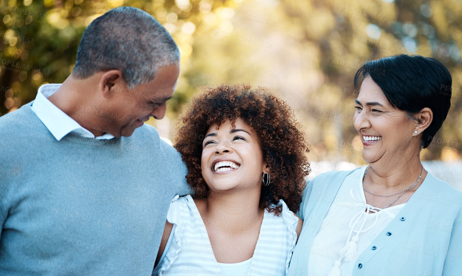 Buy stock photo Love, happy and woman with senior parents in an outdoor park for adventure, holiday or weekend trip. Laugh, smile and young female person hugging with her elderly mom and dad in field from Mexico.