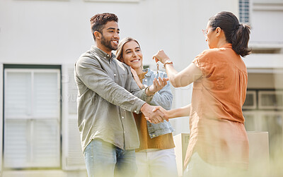 Buy stock photo House key, realtor woman and handshake with couple outdoor as congratulations, thank you or sale. Excited man, partner and shake hands with real estate agent for new home, mortgage or future property