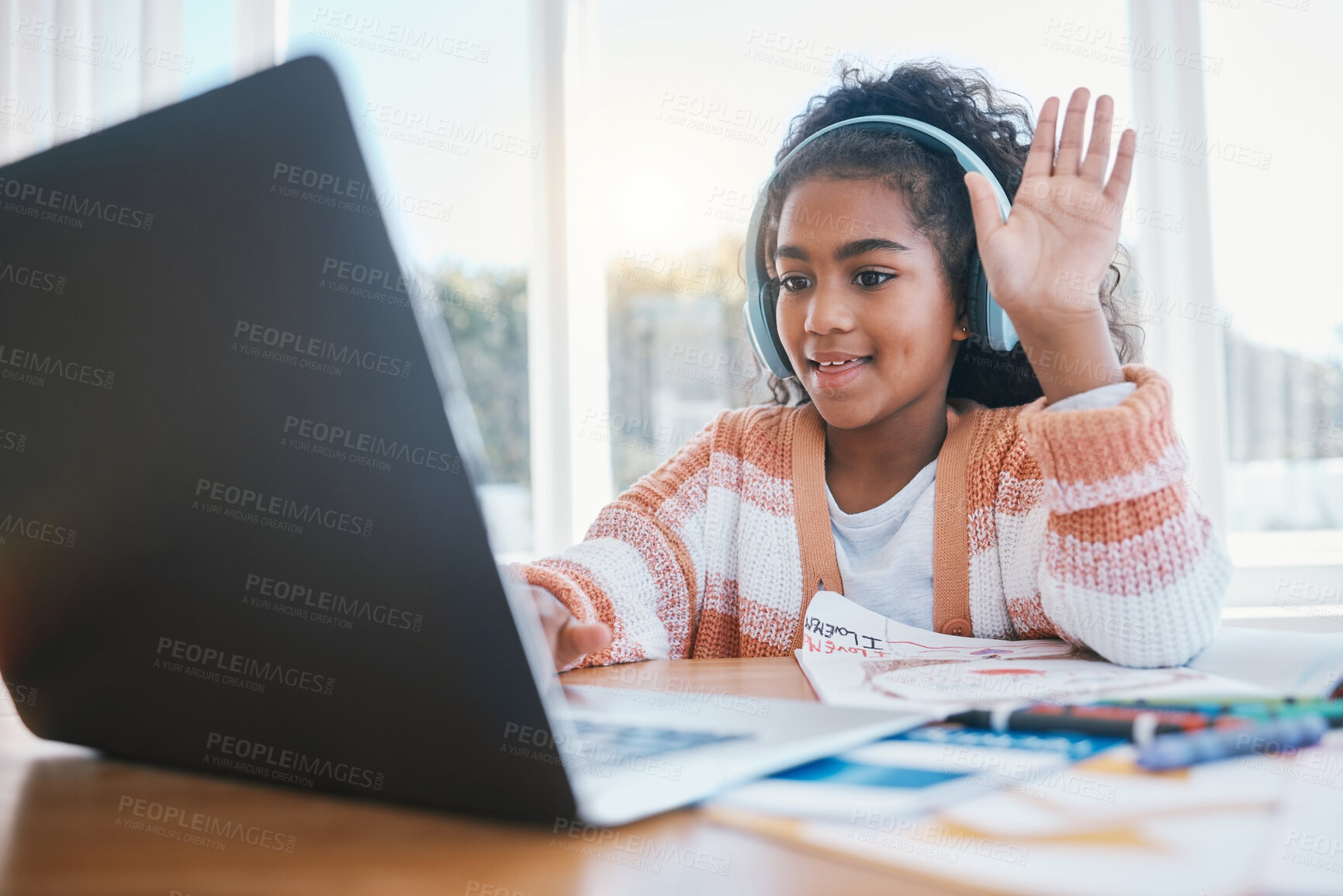 Buy stock photo Laptop, headphones and child on video call for elearning lesson for education or knowledge. Home school, technology and girl kid student wave for hello on virtual class on computer at her house.