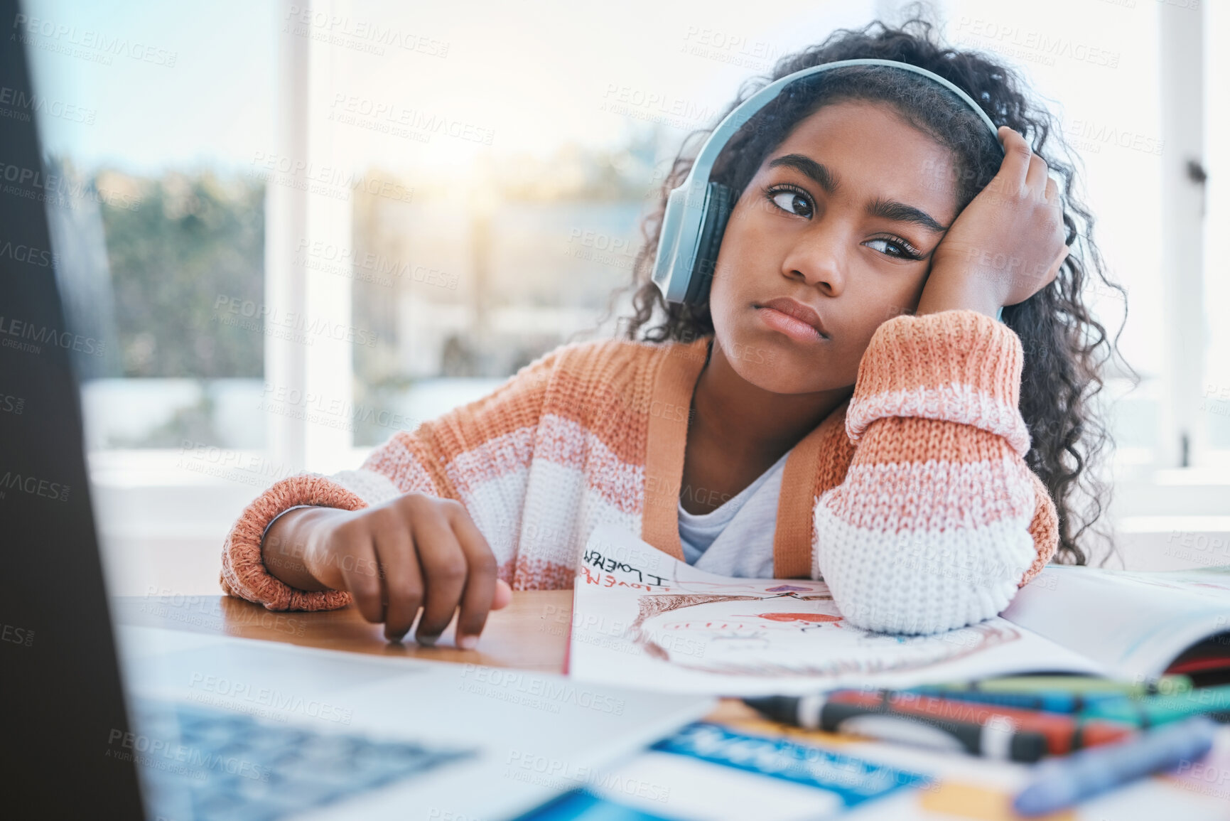 Buy stock photo Child, headphones and girl tired of home school, e learning and future online education. Thinking, bored and kid with ADHD, autism and sad at laptop while drawing and listening to audio at table