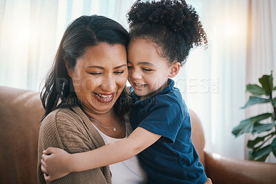 Buy stock photo Love, mother and child hug happy with care on a home couch together bonding as family with comfort and trust. Parent, playing and kid with mom in living room as happiness growth and development