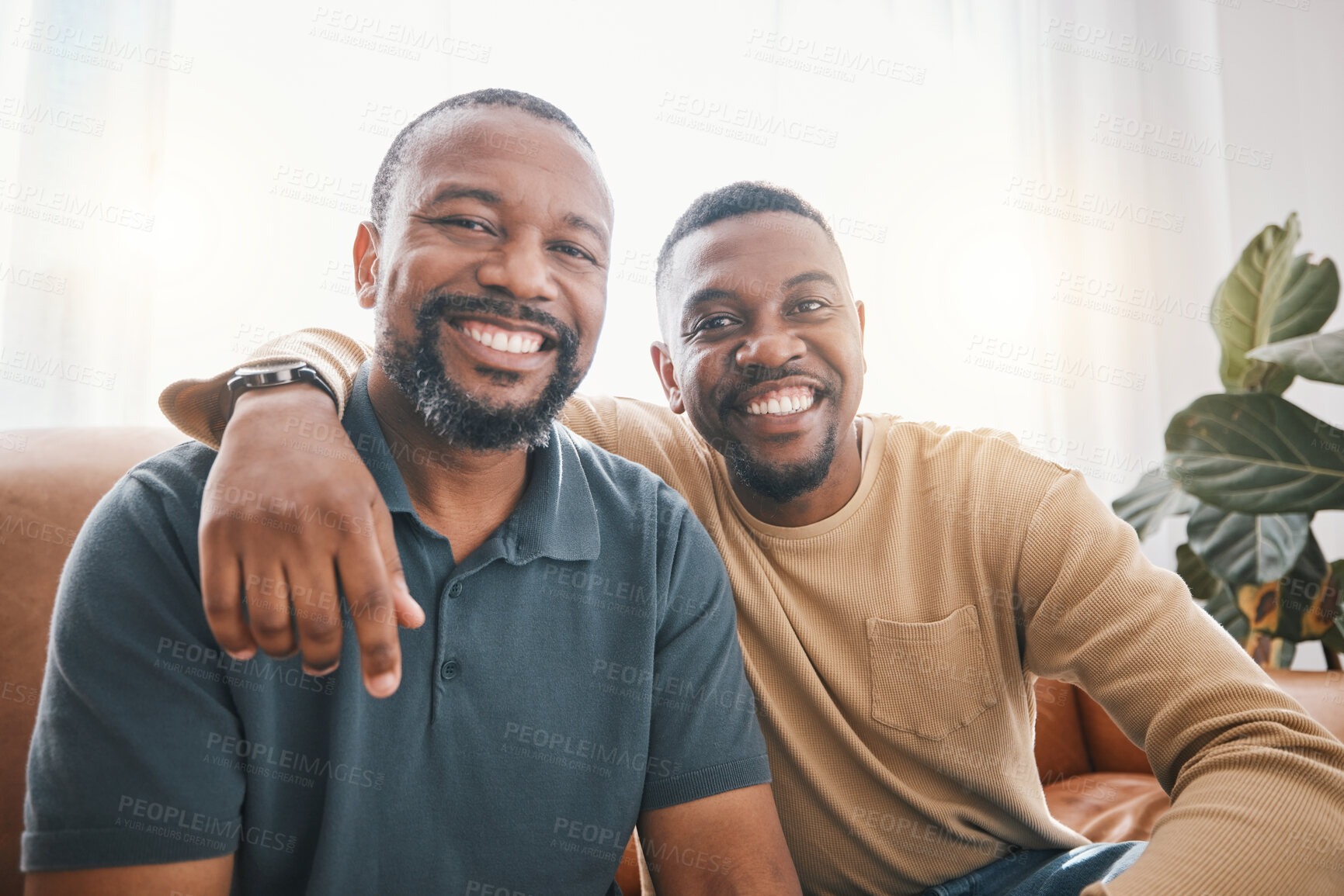 Buy stock photo Senior African dad, son and sofa for portrait, hug and smile for love, bonding or care in living room. Mature black man, fathers day and child with happy embrace, relax or excited face in family home