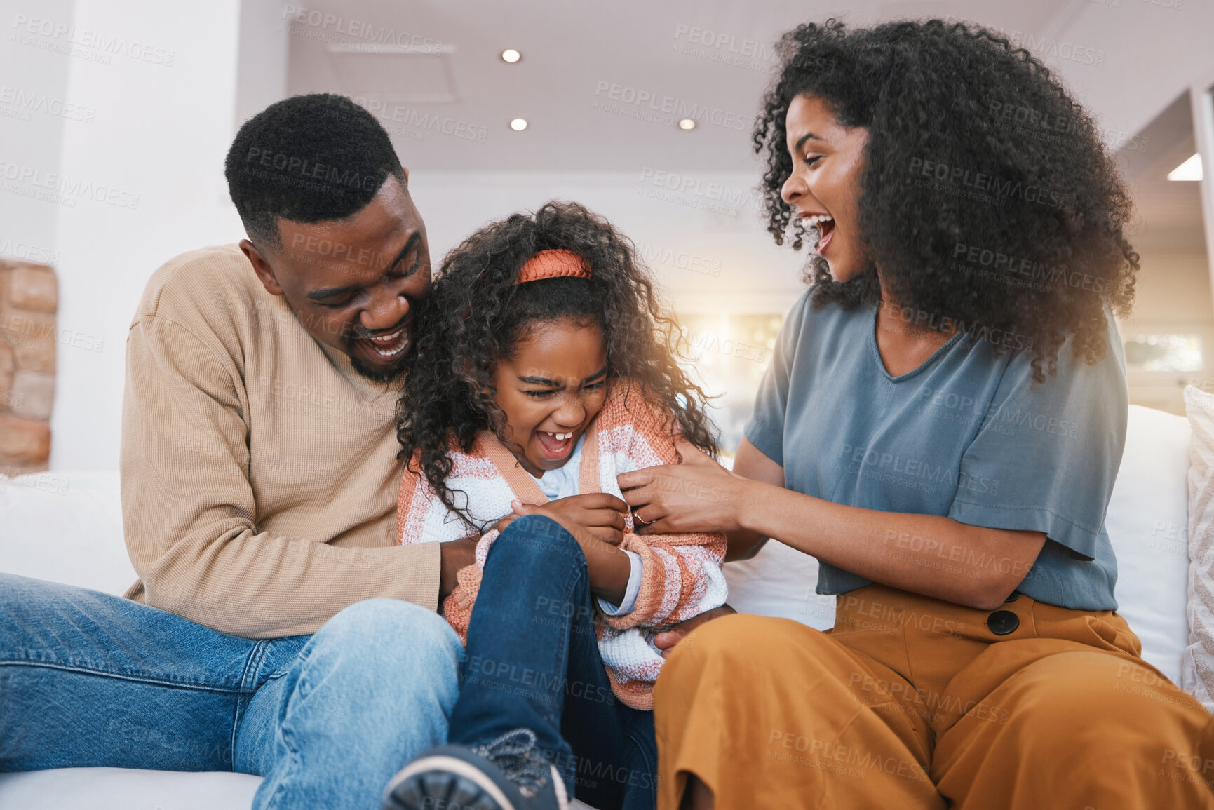 Buy stock photo Family, parents and girl laugh on sofa for bonding, healthy relationship and love in living room. Home, tickle and happy mother, father and daughter together for happiness, playing and relax on couch