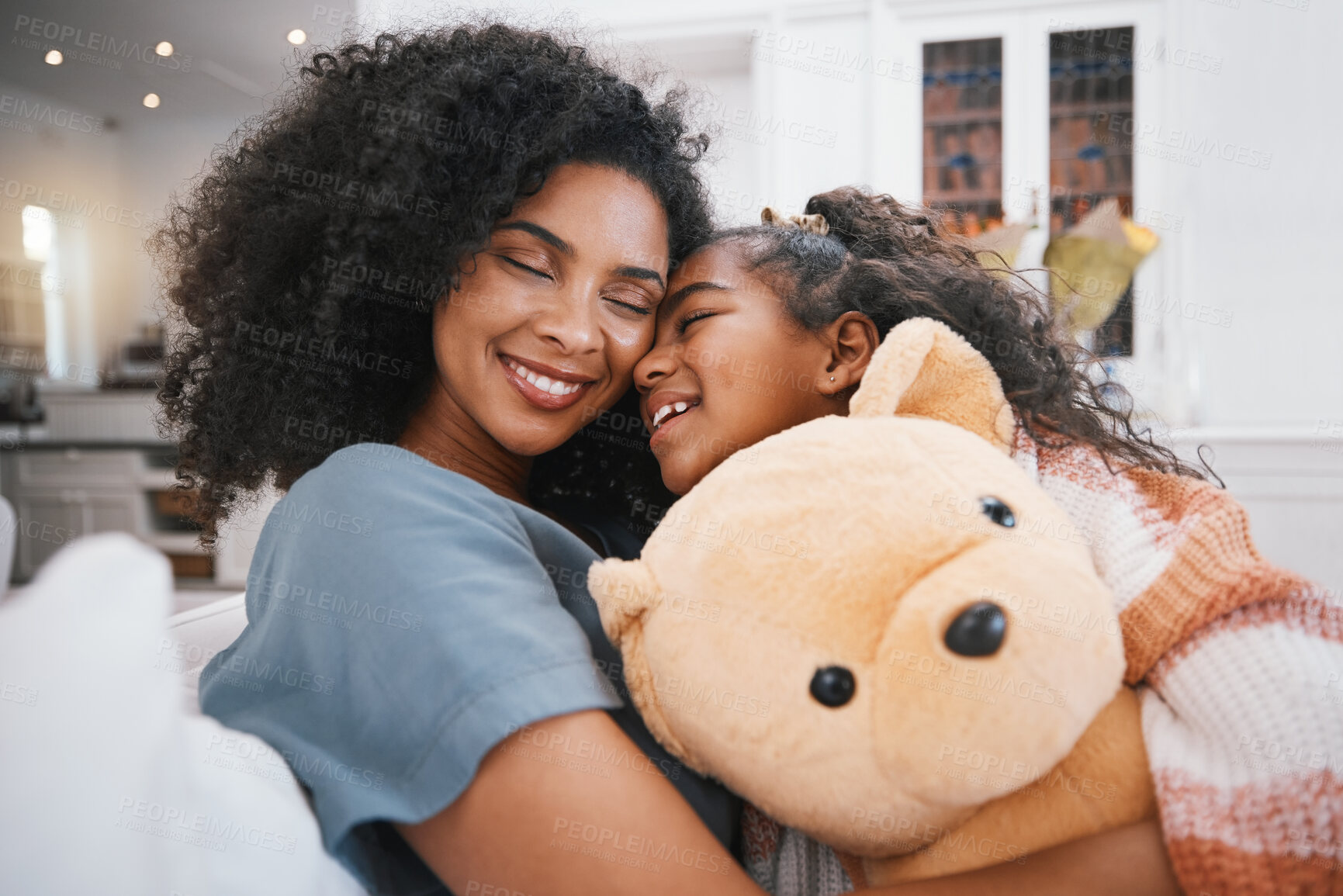 Buy stock photo Family, hug and living room with kid, mother and love together in a home on a couch. Smile, relax and young girl with mother and calm with bonding, teddy bear and care in a house on a lounge sofa