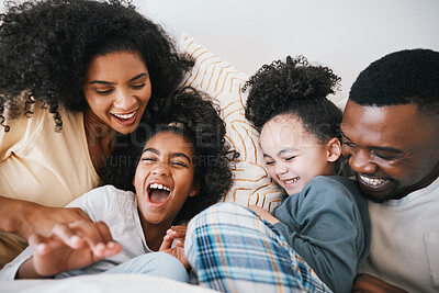 Buy stock photo Mom, dad and children in bed with tickling, comic joke and laugh with bonding, care and love in family home. Black man, mother and daughter with smile, play game or crazy in bedroom, morning or house