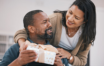 Buy stock photo Birthday, smile and couple with present box, anniversary package or product for love, congratulations or gratitude. Home, lounge and happy woman, black man or marriage people with thank you gift