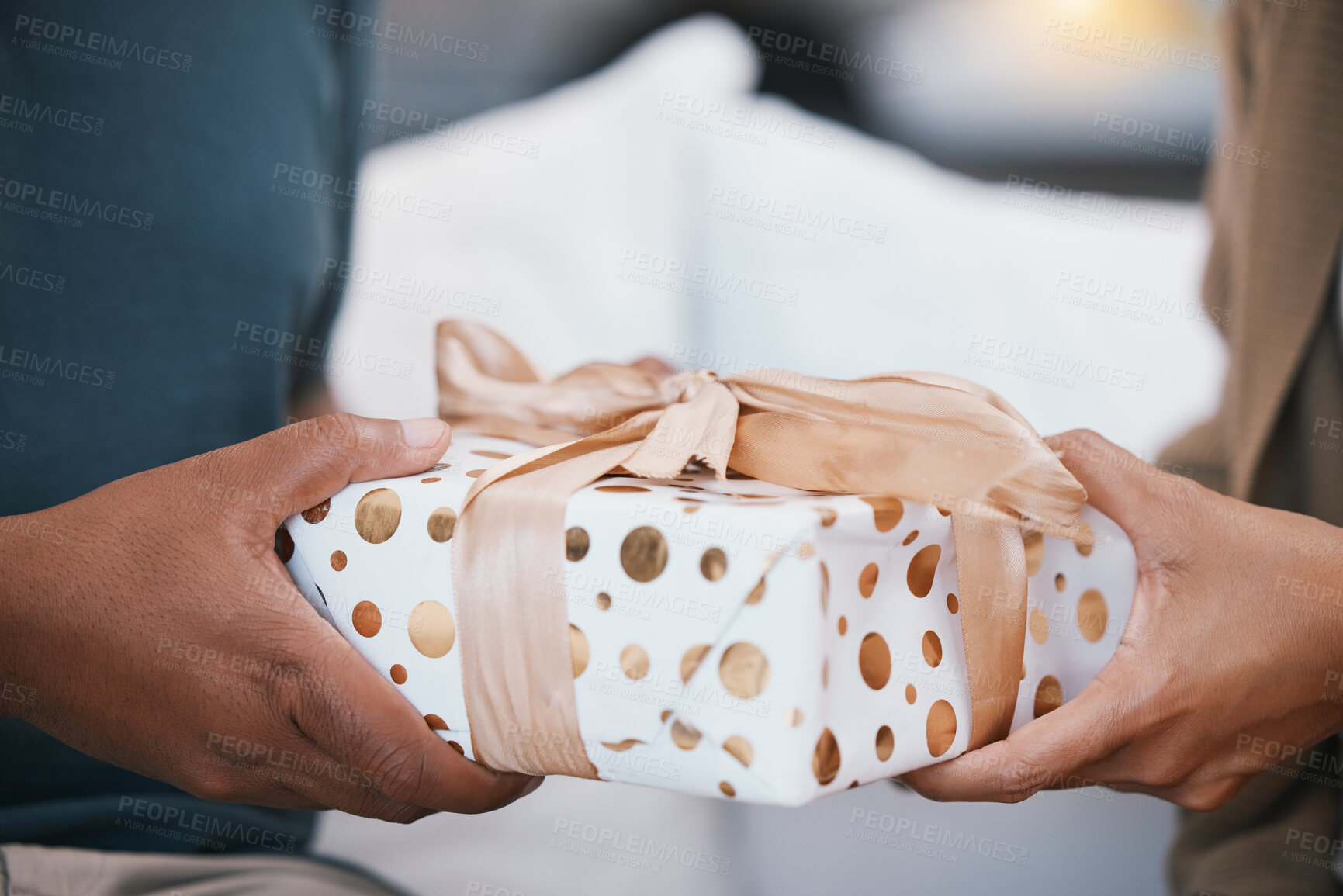 Buy stock photo Birthday, ribbon and couple hands with present, Christmas package or giving product for love, congratulations or gratitude. Living room closeup, home or marriage people care, support and holding gift