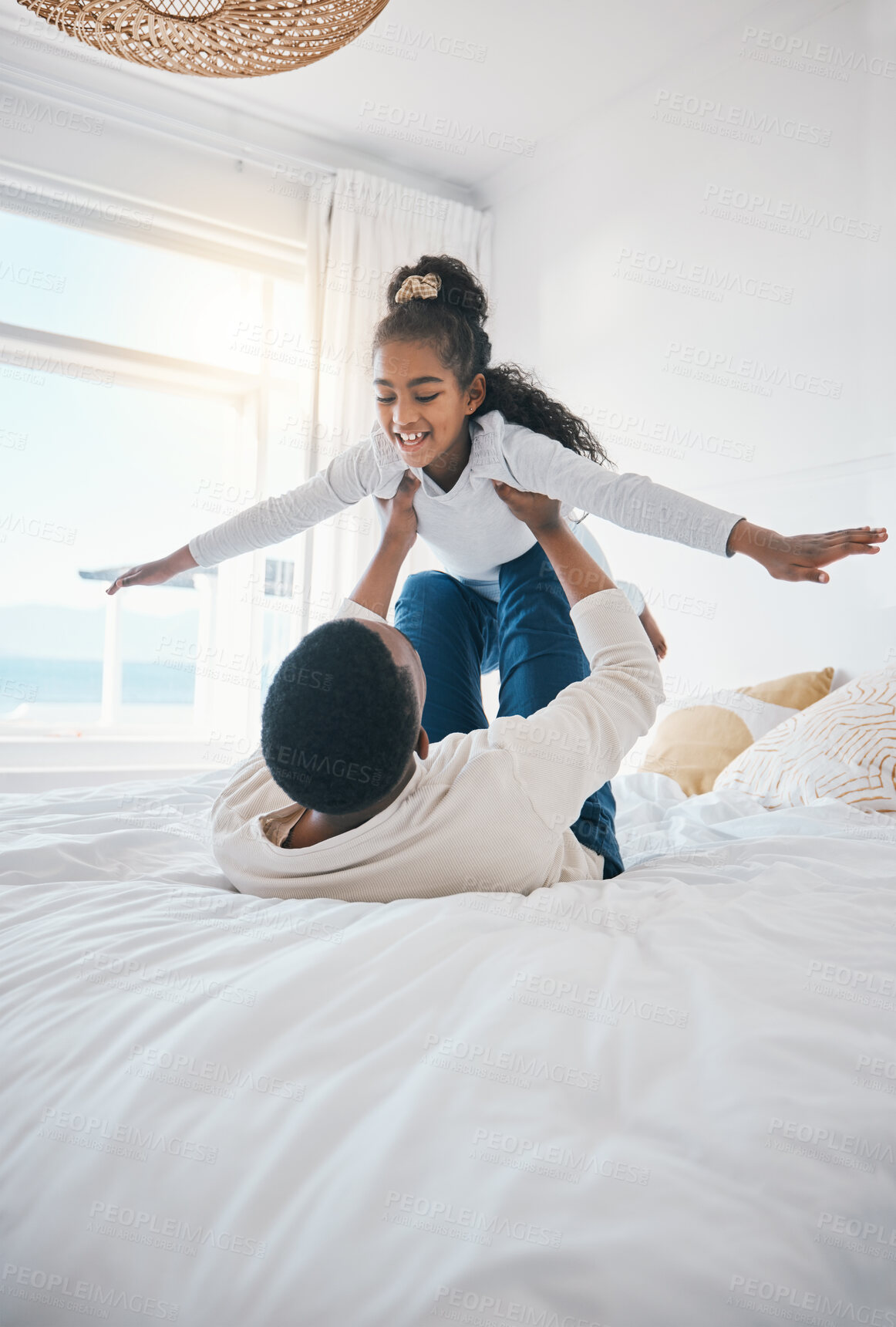 Buy stock photo Airplane, fun and bedroom with family laughing at home with a happy father and young girl together. Smile, bonding and love of a dad and child on a bed with plane game in a house with care and joy