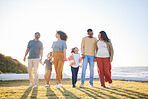 Nature field, walking and happy family holding hands, bonding and connect with countryside holiday, wellness and love. Summer, freedom and relax children, mother and father support, care and journey