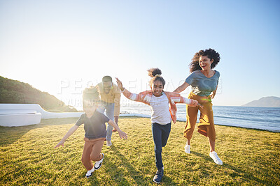 Buy stock photo Nature freedom, love and happy family running, race and playing games, parents chase children and energy on green field. Blue sky, speed and fast kids, mom and dad have fun, wellness or bond together