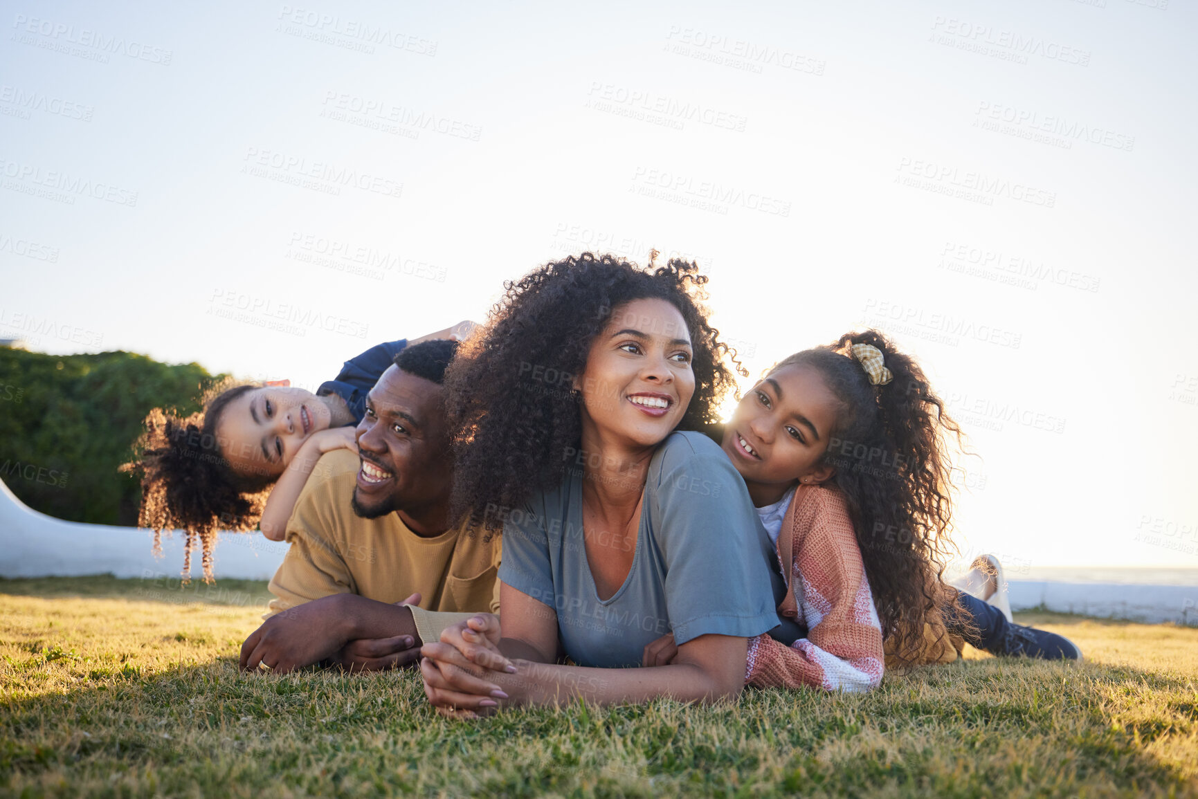 Buy stock photo Grass, happy and family relax on vacation, bonding and having fun together on mockup space. Children, smile and interracial parents with kids in nature to travel on holiday, care and love outdoor