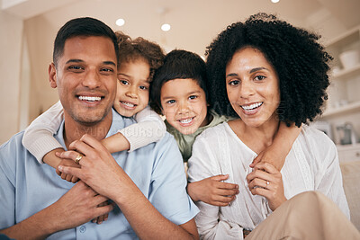 Happy family, portrait and hug on sofa for love, support or bonding on holiday or weekend together at home. Father, mother and children smile in happiness, relax or break and day off on lounge couch