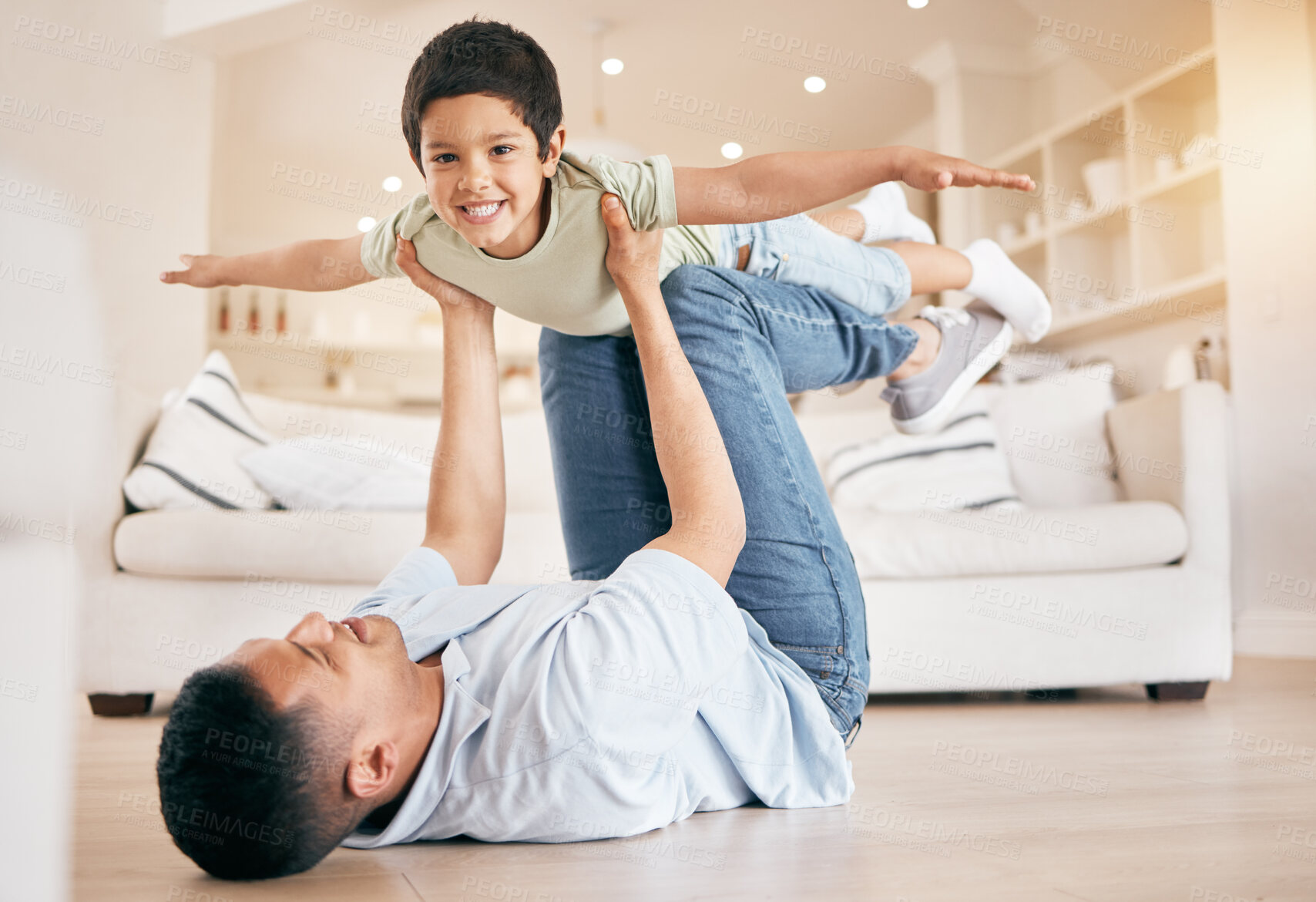 Buy stock photo Portrait, child and father in living room for airplane games, support or relax at home for crazy fun. Dad, happy boy or excited to fly on floor for freedom, fantasy or balance of play, care or energy