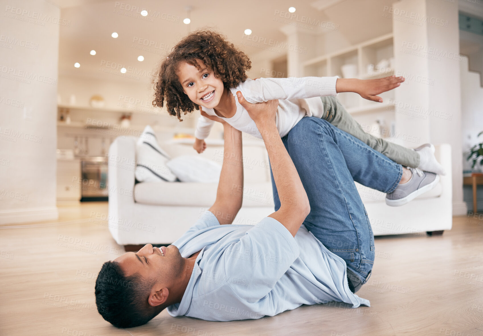 Buy stock photo Father, child and airplane game on floor, love and portrait with support, home and happiness in a living room. Family, dad and kid playing, fly and bonding with care, relax and smile on weekend break