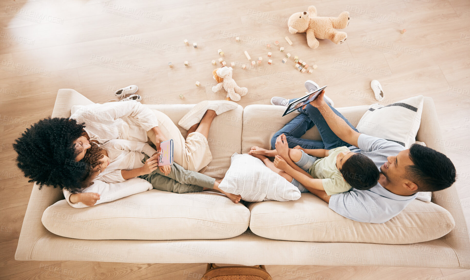 Buy stock photo Happy family, sofa and relax in bonding, love or support together in living room above at home. Top view of mother, father and children enjoying holiday break, weekend or day off on lounge couch