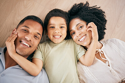 Buy stock photo Portrait, top view and family with love, floor and happiness with memory, bonding and relax together. Face, parents and mother with father, child and kid on the ground, home and relax with vacation