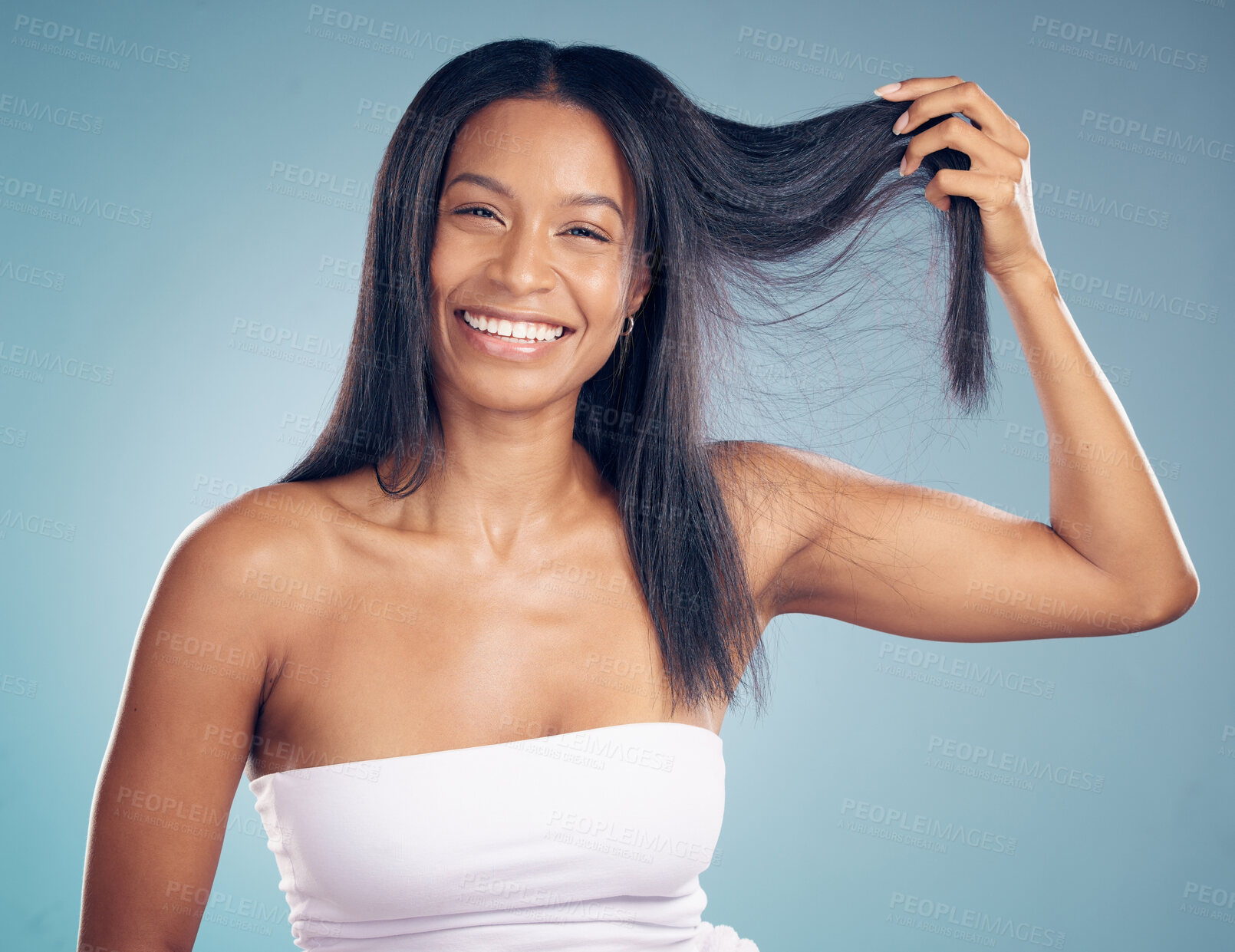 Buy stock photo Portrait, happy woman and hair in hands for beauty in studio isolated on a blue background. Face, natural hairstyle and smile of model in healthy salon treatment, wellness and care of hairdresser.