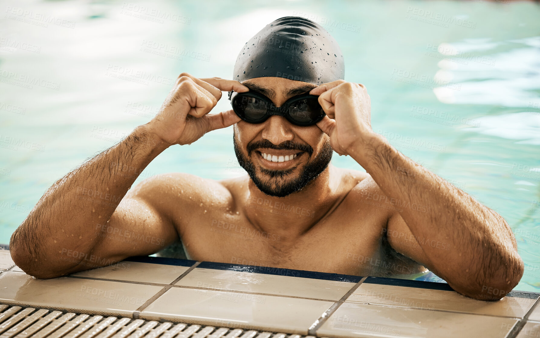 Buy stock photo Happy, man and portrait of athlete in swimming pool with gear for training, workout or exercise for wellness, health or fitness. Swimmer, goggles or smile for sport, challenge or cardio in water polo