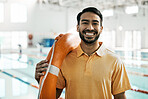 Lifeguard portrait, swimming pool and happy man with safety lifebuoy for rescue support, help or life saving. Smile, equipment and first aid expert for protection, security and medical emergency 