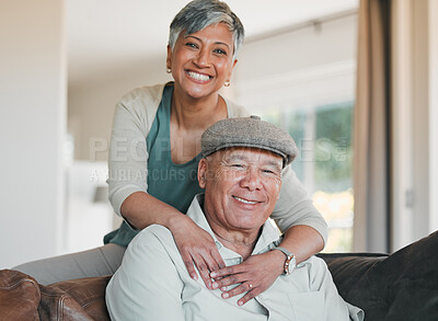 Buy stock photo Senior couple, portrait and smile in home for retirement, marriage commitment and loyalty to partner. Happy man, woman and hug of support, trust and freedom to relax, love and together in living room