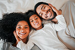 Portrait, top view and family with love, bed and relax with happiness, morning and weekend break. Face, parents and mother with father, girl and child with home, bedroom or rest with support and care