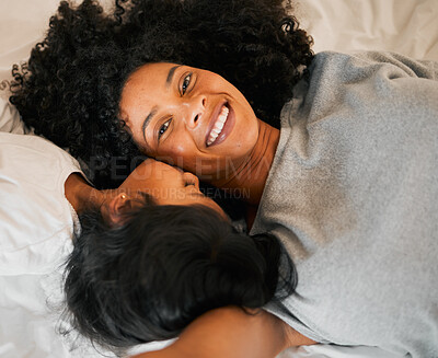 Buy stock photo Above, selfie and kiss from a child and mother for relax on the bed, memory or bonding. Happy, mothers day and portrait of a mom taking a photo with a girl kid with care in a house for comfort