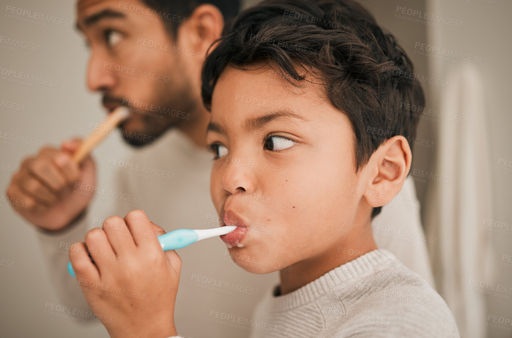 Buy stock photo Face, boy and child brushing teeth with father for hygiene, morning routine or development of healthy oral care at home. Kid, dad and toothbrush for dental cleaning, fresh breath or mouth in bathroom