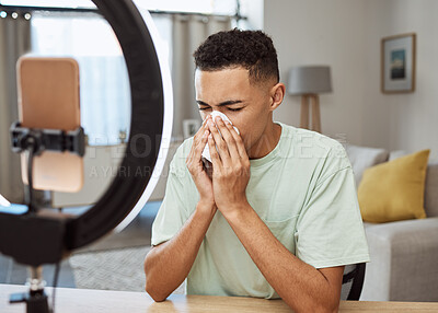 Buy stock photo Sick, live streaming and man with flu, fever and blowing nose or tired of social media and sad online in home. Medical, tissue and frustrated person or influencer on internet, web or blog with sinus