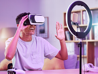 Buy stock photo VR, live streaming and man gamer with future on social media for digital connection in metaverse vlog in a home. Ring light, streamer and content creator or person speaking on internet show as host