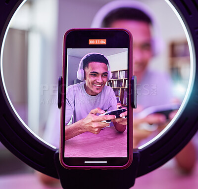 Buy stock photo Influencer, man and gaming for social media or live streaming, gamer online with technology and phone screen. Ring light, streamer and closeup, filming video or content creation with broadcast