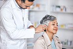 Hearing aid, medical and consulting with doctor and woman with a disability for healthcare, technology and sound waves. Medicine, wellness and audio with people and cochlear implant for hearing loss