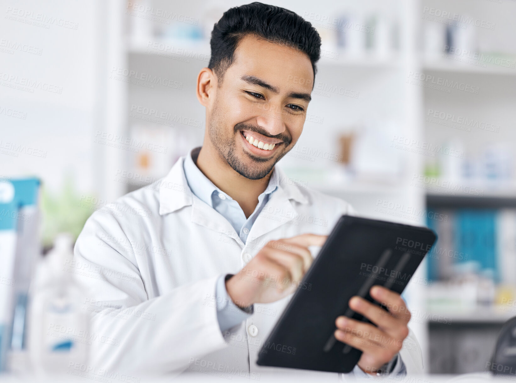 Buy stock photo Man in pharmacy with tablet, checklist and smile for medicine with online website info. Pharmacist, digital app and inventory research with check for pharmaceutical drugs, tech or healthcare stock.