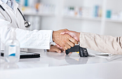 Buy stock photo Pharmacist, doctor and shaking hands for pharmacy, medical support and customer. services at desk. Professional healthcare worker and patient handshake, thank you and success with medicine in retail