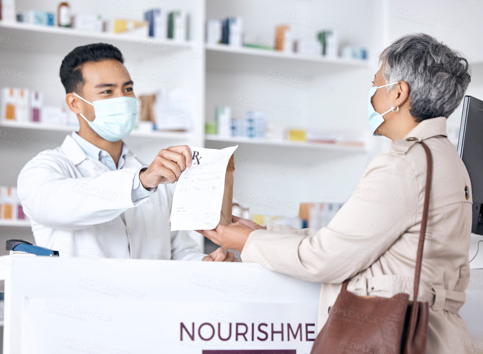 Buy stock photo Pharmacist, package and customer in face mask for healthcare support, service and virus compliance in store. Medical doctor and sick patient with paper bag, covid medicine and pharmacy or clinic desk