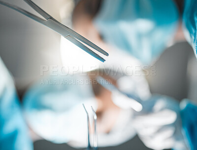 Buy stock photo Healthcare, surgery tools and doctors in theatre for operation, emergency or risk with safety ppe at hospital. Medical, wellness and surgeon or professional nurse with metal equipment for injury 