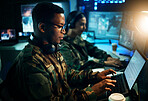 Military control room, computer and soldier at desk, typing code and tech for communication army office. Security, global surveillance and black man at laptop in government cyber data command center.