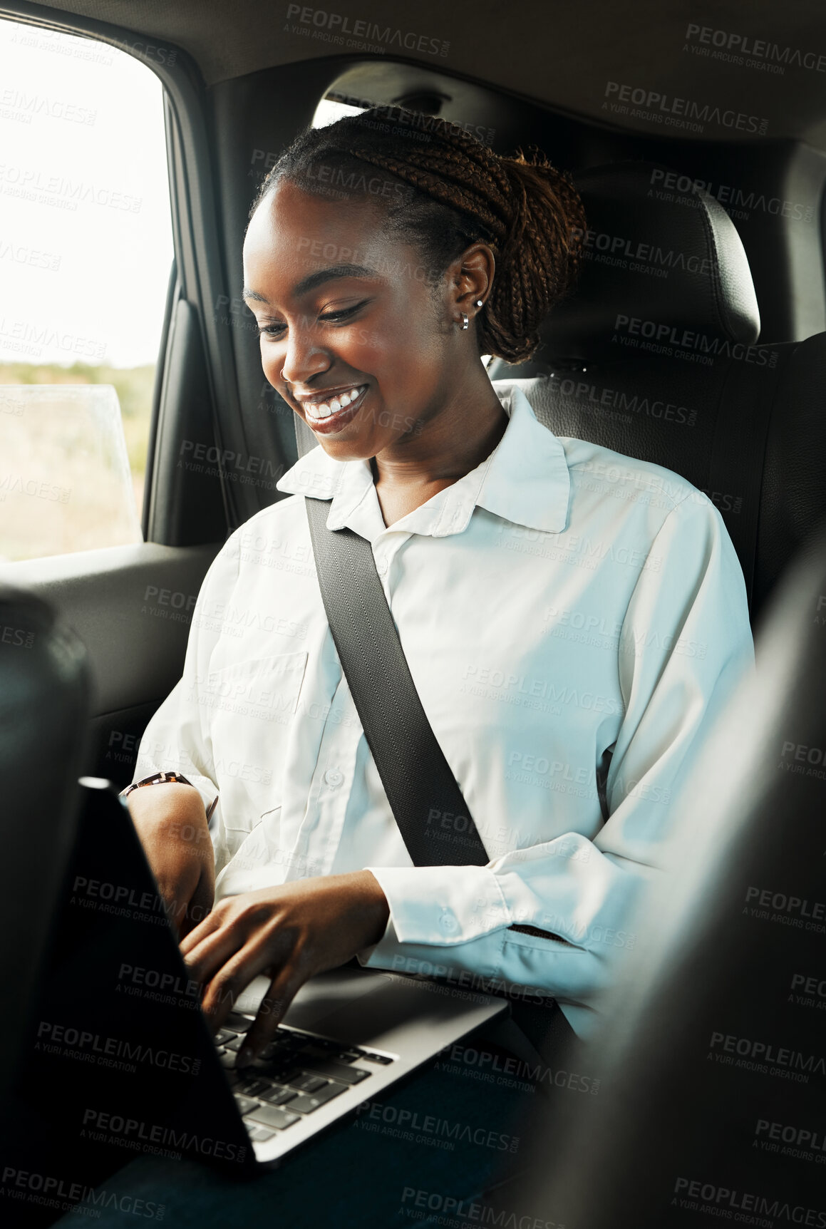 Buy stock photo Laptop, smile and black woman typing in car to travel, reading email for remote work and social media. Computer, taxi and happy African person on business trip, journey and commute in transportation