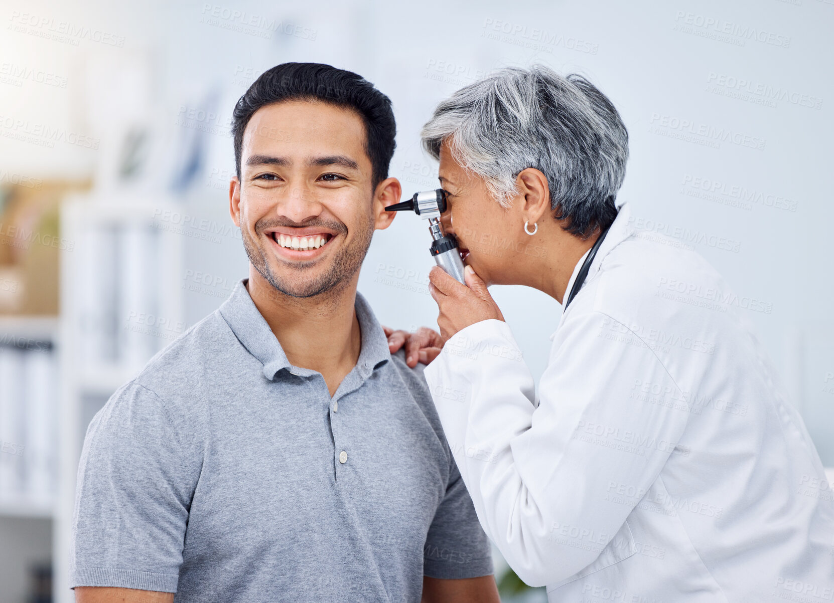 Buy stock photo Doctor, patient or ear check for healthcare or wellness at hospital with otolaryngology specialist. Man, smile or senior physician woman with otoscope test for hearing problem or medical consultation