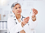 Vaccine injection, doctor and woman with bottle, healthcare safety and immunity in clinic. Mature medical worker with needle, vial and medicine container for help with virus, vaccination and flu shot