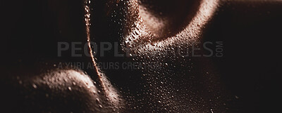 Buy stock photo Body, water drops or skin and texture of a person for dermatology, skincare and hygiene. Zoom on aesthetic model for art deco, silhouette and sweat with droplets, creative and dark background