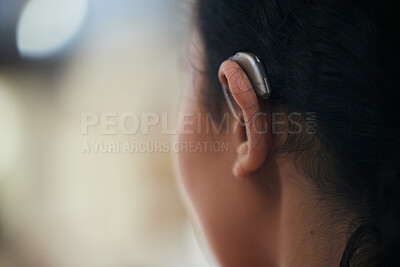 Buy stock photo Hearing aid, closeup and ear with a person with a disability for helping with audio and medical implant. Technology, patient and healthcare problem with listening support and wellness tool with back