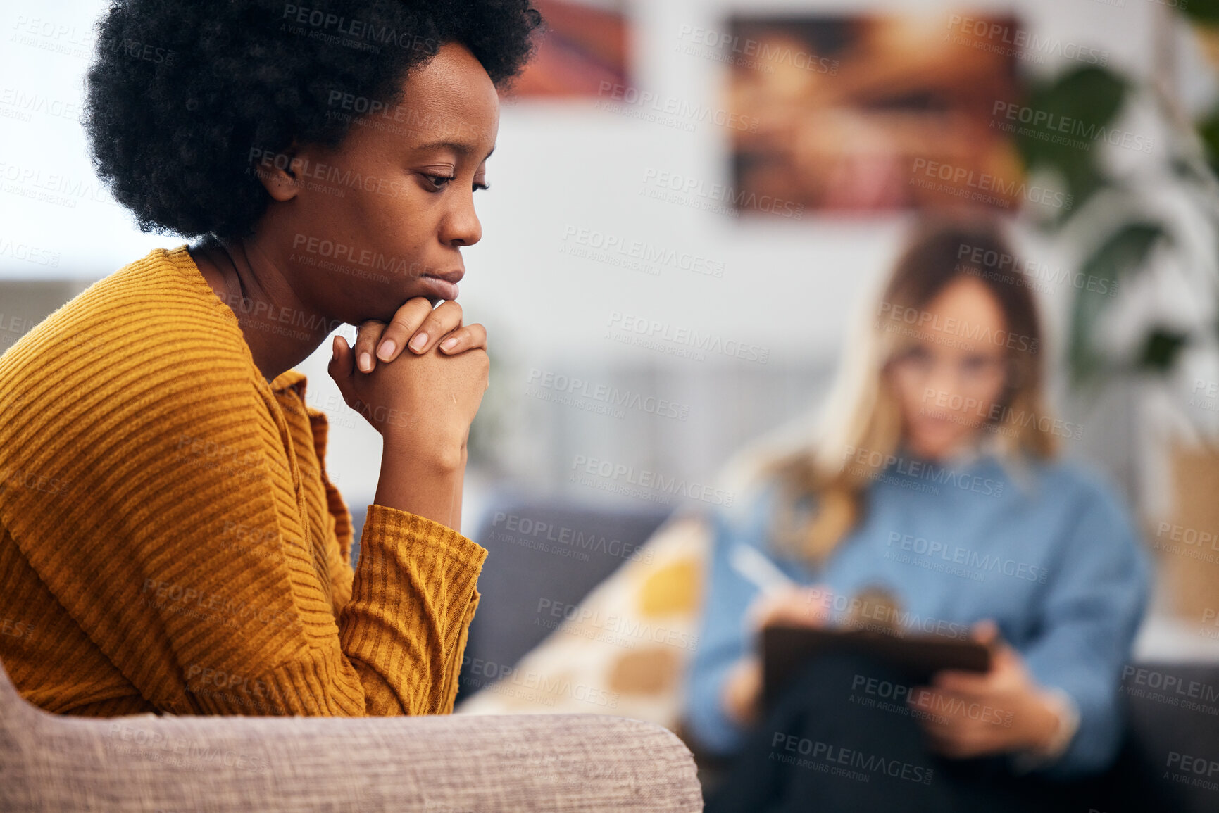 Buy stock photo Mental health, depression and psychology with a black woman in therapy, talking to a professional. Anxiety, stress or support with a young patient in session with a psychologist for grief counseling 