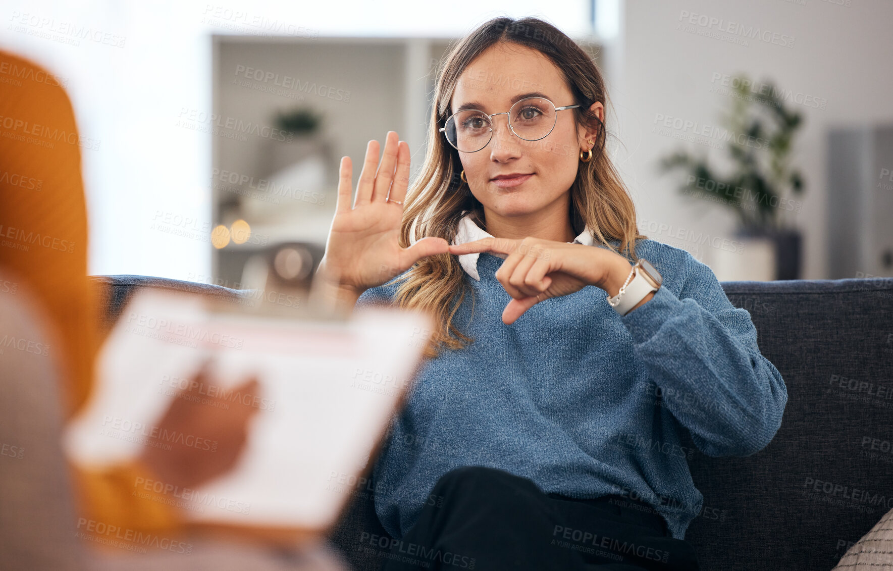 Buy stock photo Sign language, speech therapy and woman talking to therapist in a consultation or counseling conversation. Communication, support and professional psychologist help person learning and speaking